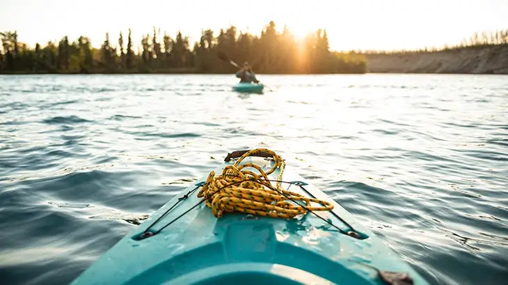 Girl kayaking on river