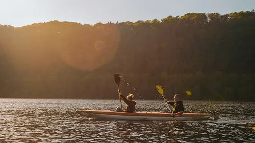 Two people canoeing on lake