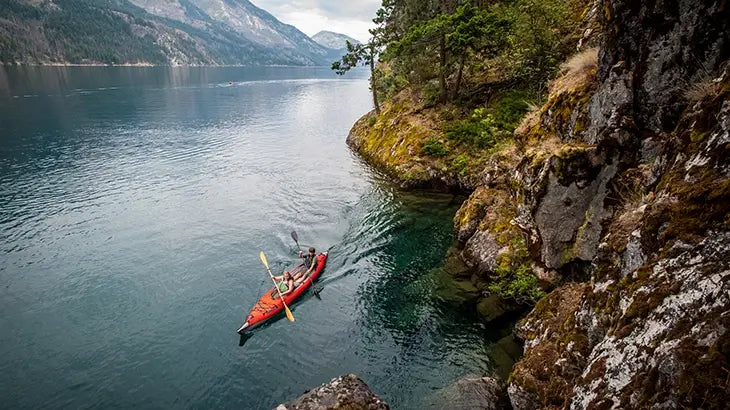 Inflatable Kayak on lake mountain backdrop