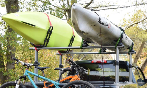 kayaks strapped to a truck rack