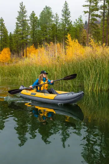 woman paddling inflatable kayak