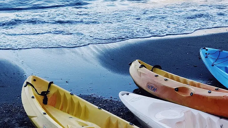 Kayaks stored on a rack on the beach