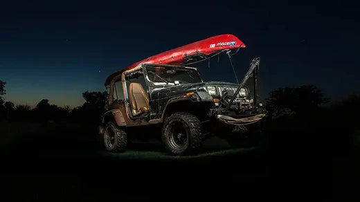 Kayak being transported on a Jeep