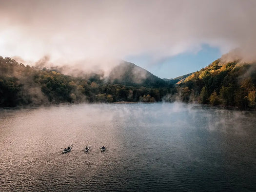 Aerial view of three kayakers on a lake