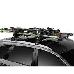 Thule SnowPack Extender Ski/Snowboard Roof Rack installed on a car side