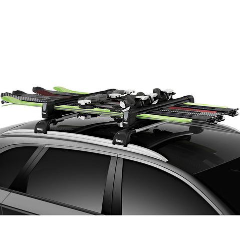 Thule SnowPack Extender Ski/Snowboard Roof Rack installed on a car side