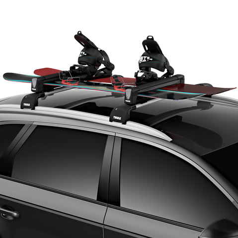 Thule SnowPack Ski/Snowboard Roof Rack loaded with snowboards