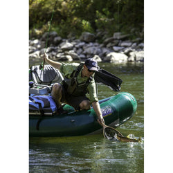 Outcast PAC 1300 Self-Bailing Raft  netting a fish