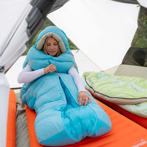 MSR Elixir 4 Person Backpacking Tent camper sitting in sleeping bag