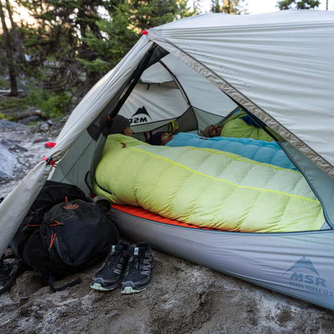 MSR Hubba Hubba LT 3 Person Backpacking Tent view of inside from opening with three campers in sleeping bags