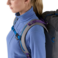 Patagonia Women's R1 Jacket in Abundant Blue close up of model wearing backpack
