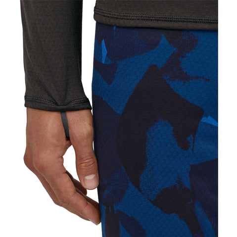 Patagonia Men's Capilene Mid Weight Crew Shirt in Black model view wrist