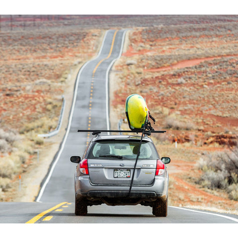 Kuat Class 2 J Cradle Roof Rack Kayak Carrier driving down the road