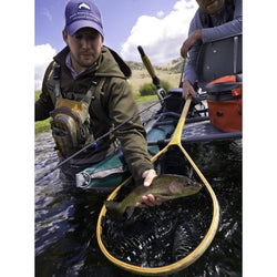 Outcast PAC 1200 Pro Series Pontoon Boat On The Water With Paddler Holding A Fish