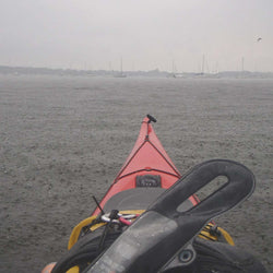 Aquapac VHF Pro Dry Case kayaker using