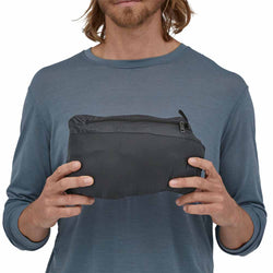 Patagonia Men's Down Sweater Vest in Black model packed