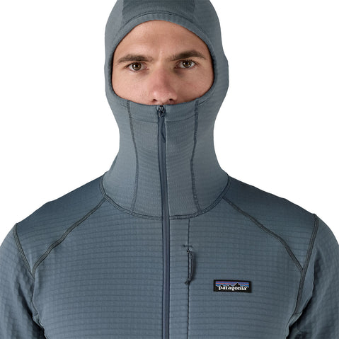 Patagonia Men's R1 Pullover Hoody close up of model with hood on front view