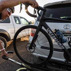 Kuat Sherpa 2.0 2 Bike Hitch Rack close up of man taking bike off of rack