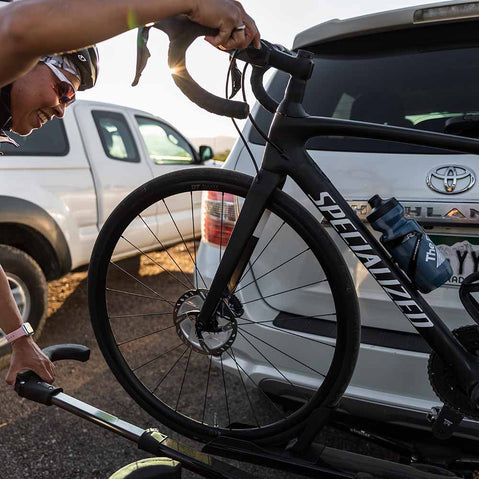 Kuat Sherpa 2.0 2 Bike Hitch Rack close up of man taking bike off of rack