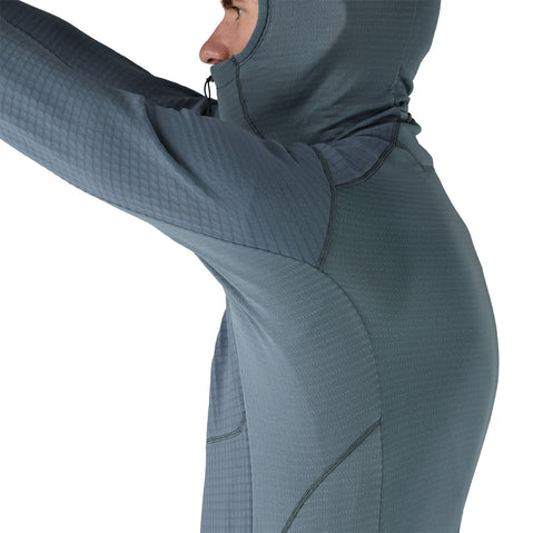 Patagonia Men's R1 Pullover Hoody close up of modes raising his arm side view