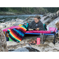 AIRE Landing Pad in Cranberry on a cot