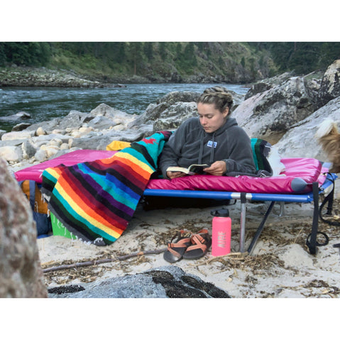 AIRE Landing Pad in Cranberry on a cot