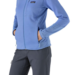 Patagonia Women's R1 Jacket in Abundant Blue showing hands in front pockets