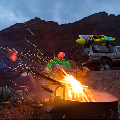 Kuat Class 4 Folding J Cradle Roof Rack Kayak Carrier paddlers by a fire