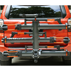 Kuat NV 2.0 1 Bike Add-On Hitch Rack in Gray Metallic/Orange Anodize installed on a car front view