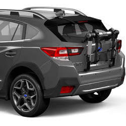 Thule OutWay Hanging 2 Bike Trunk Rack in Silver/Black installed on a car angle