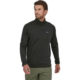 Patagonia Men's R1 Pullover Top in Black model view angle