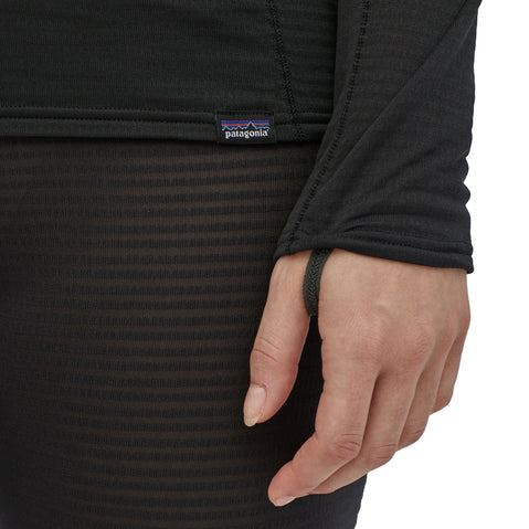 Patagonia Women's Capilene Thermal Weight Crew Shirt model in black close up of thumb loop