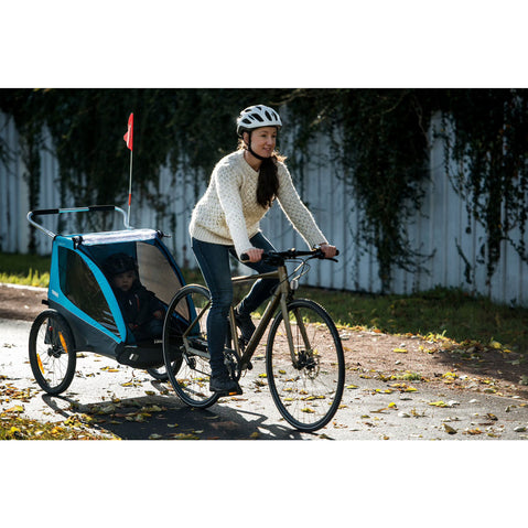 Thule Coaster XT Bicycle Trailer with woman biking