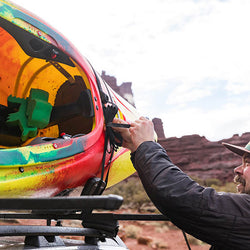 Kuat Class 2 J Cradle Roof Rack Kayak Carrier tying down a kayak