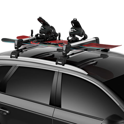 Thule SnowPack Extender Ski/Snowboard Roof Rack installed on a car
