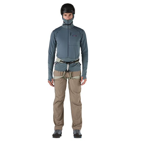 Patagonia Men's R1 Pullover Hoody model with hood on wearing a helmet and harness front view