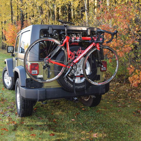 Malone RunWay Bike Spare Tire Rack with bike loaded on a Jeep