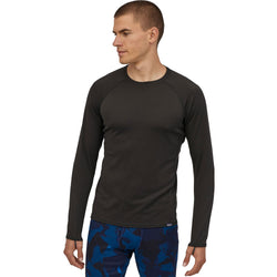 Patagonia Men's Capilene Mid Weight Crew Shirt in Black model view angle