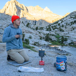 Therm-A-Rest Z Seat Camping Seat with a camper kneeling