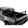 Thule Xsporter Pro Truck Bed Rack in Black installed on a car