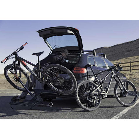 Kuat Sherpa 2.0 2 Bike Hitch Rack showing rear vehicle access with bikes