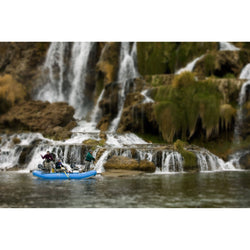Outcast PAC 1400 Self-Bailing Raft rowing by a waterfall