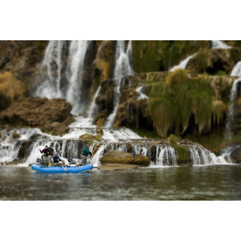Outcast PAC 1400 Self-Bailing Raft rowing by a waterfall