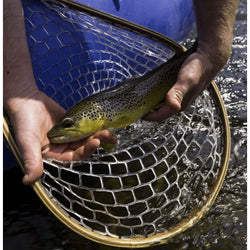 Outcast PAC 1400 Self-Bailing Raft with fish in a net