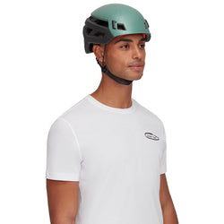 Mammut Wall Rider Rock Climbing Helmet Dark Jade worn by a climber