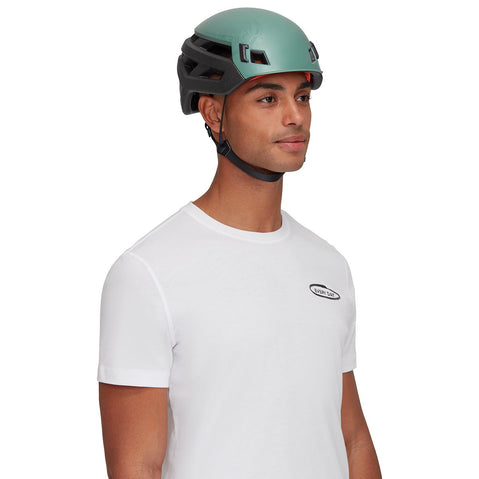 Mammut Wall Rider Rock Climbing Helmet Dark Jade worn by a climber