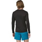 Patagonia Men's Capilene Cool Lightweight Long Sleeve Shirt in Black model side