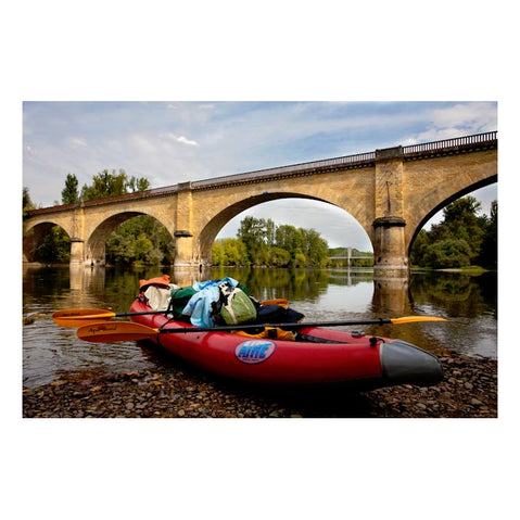 AIRE Super Lynx Inflatable Kayak in Red on a beach